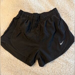 Black Nike running shorts